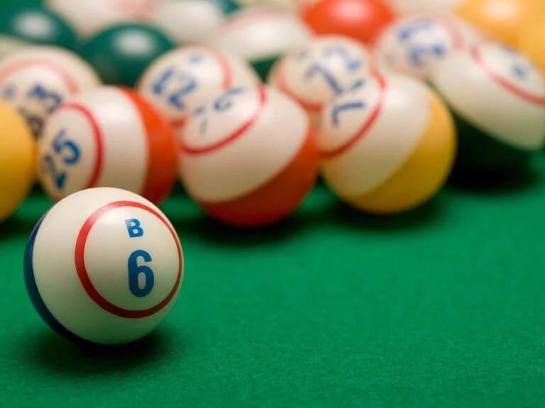 Numbered bingo balls on a green felt table